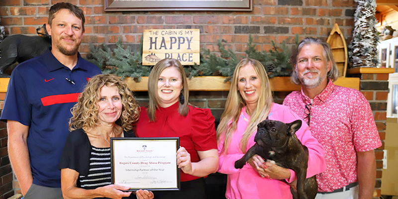 group posing with certificate