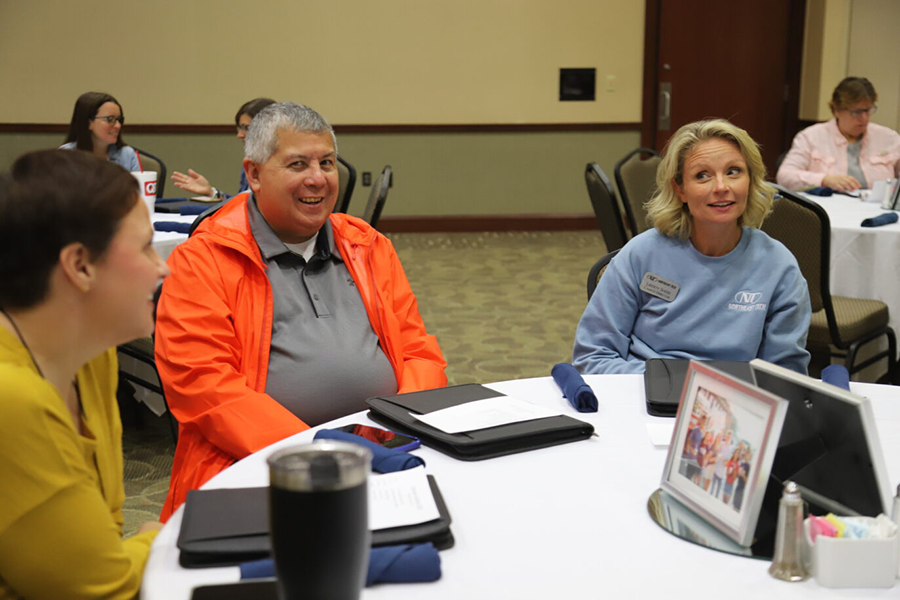 people at a lunch meeting round table