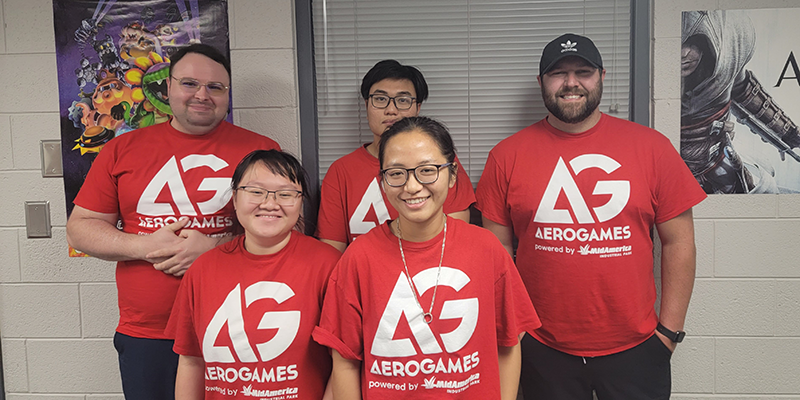 College students wearing red AeroGames shirts.