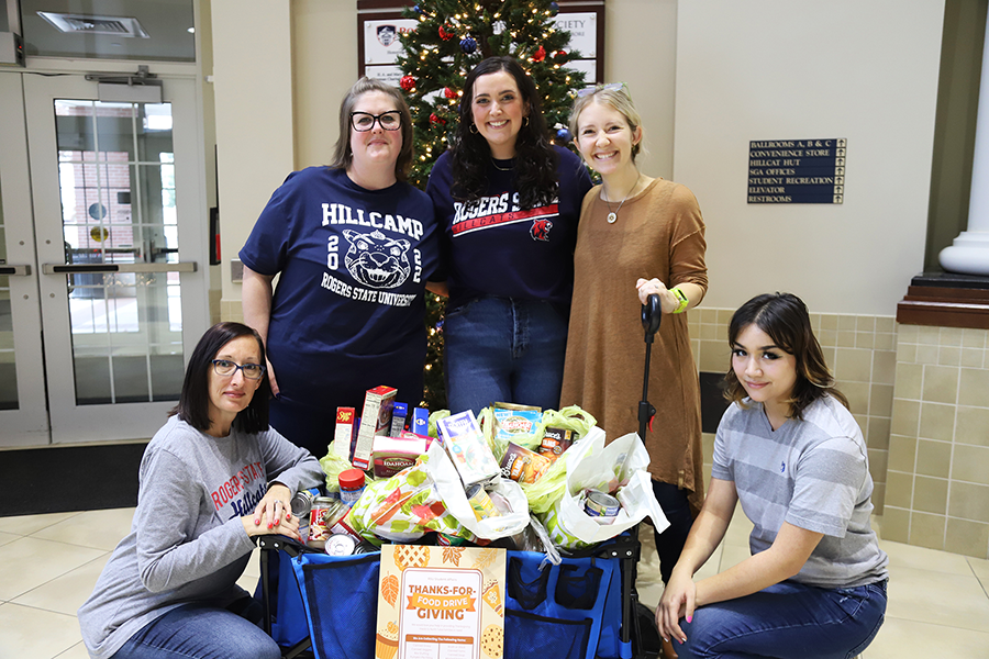 women standing by donated food