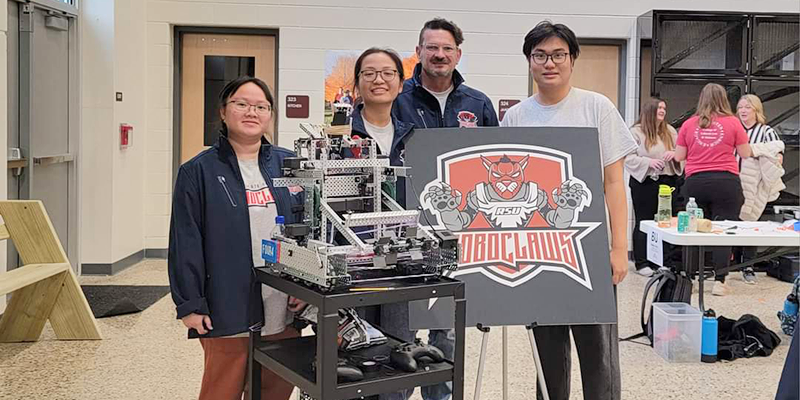 Rogers State University’s robotics team members are My Le (from left), Nghi Nguyen, Curtis Sparling (advisor) and Nghi Nguyen.