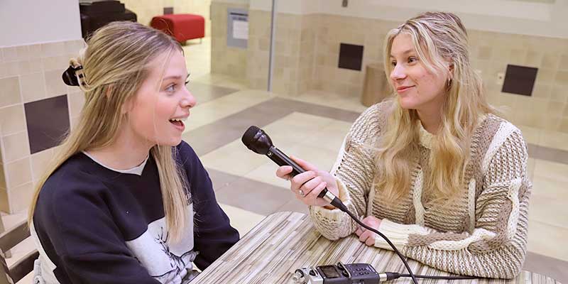 Communications majors Elizabeth Lyles of Glenpool (left) and Skylar Scott of Collinsville (right) work on a “Life on College Hill” podcast for RSU Radio General Manager Tip Crowley’s Podcast Production class. Now in its second season, “Life on College Hill” helps RSU students navigate college life.