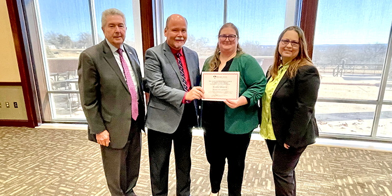 Rogers State University Assistant Registrar Alaina Sprague was recently named the recipient of the Dr. James D. Hess Excellence in Education Award. Sprague received the award at RSU’s 2024 Spring Convocation, held Jan. 10 in the Dr. Carolyn Taylor Center. Pictured: RSU President Dr. Larry Rice (from left), RSU Vice President for Academic Affairs Dr. Richard Beck, RSU Assistant Registrar Alaina Sprague, and RSU Staff Advisory Council Chair Audrey Baker.