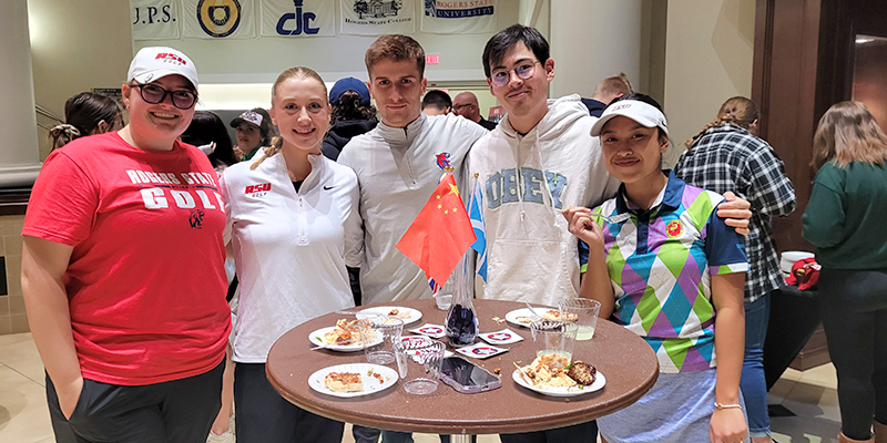 group posing around table