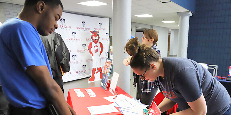 Boy signing up for Tech Day.