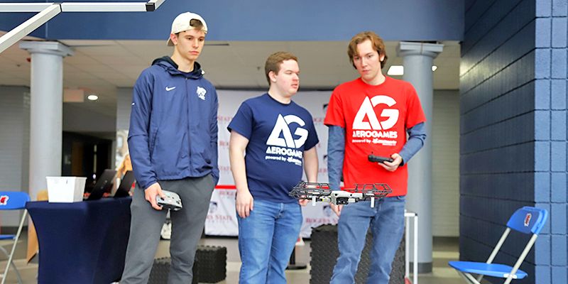 Boys flying a drone.