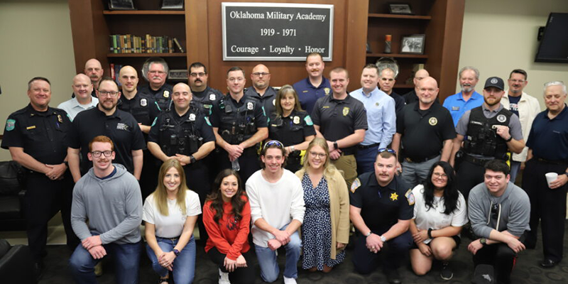 Students posing with cops.