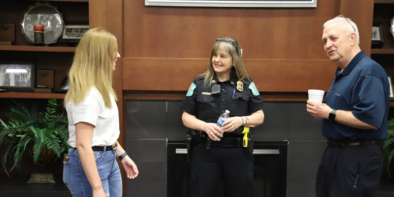 Girl talking to cops.