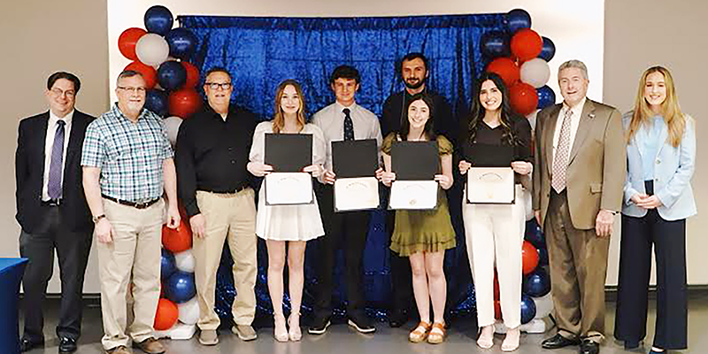 group photo holding certificates