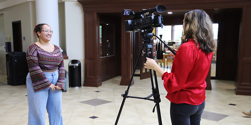 Girl giving an interview on camera.