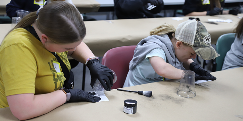 Students learning how to do fingerprinting.