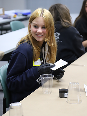 Students learning how to do fingerprinting.