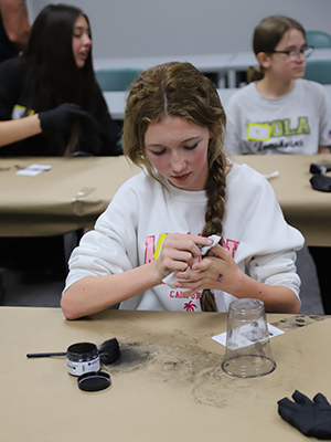 Students learning how to do fingerprinting.