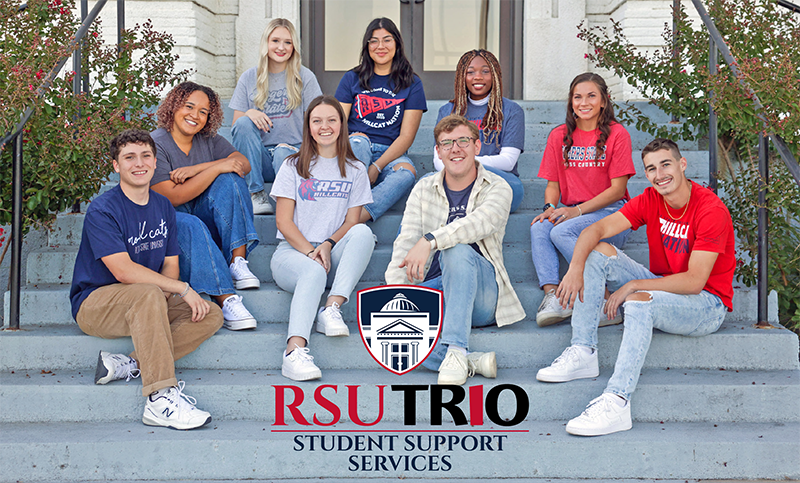 Students sitting on steps outside Prep Hall 