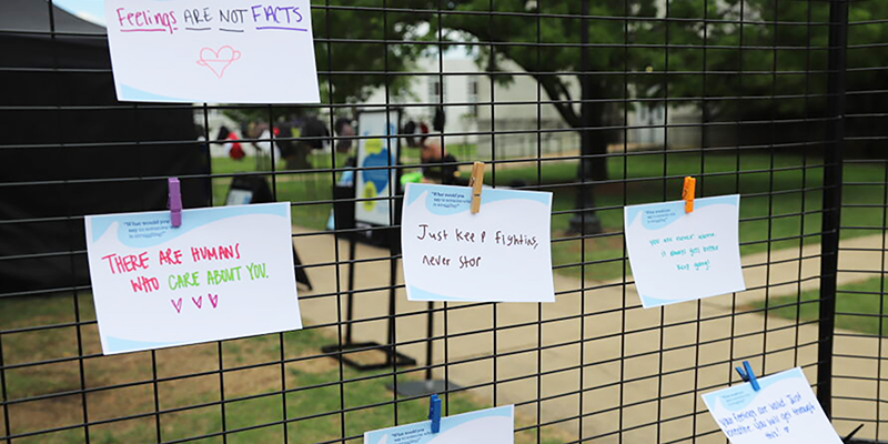 Positive notes clipped to fence