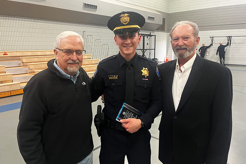 RSU Assistant Professor Gerry Bender (left) and Assistant Professor Rob Turner (right) congratulate RSU alumnus Hunter Bowen (center) for the recent completion of his training at the Tulsa Police Academy. Collinsville native Brown finished his training with top scholar honors.