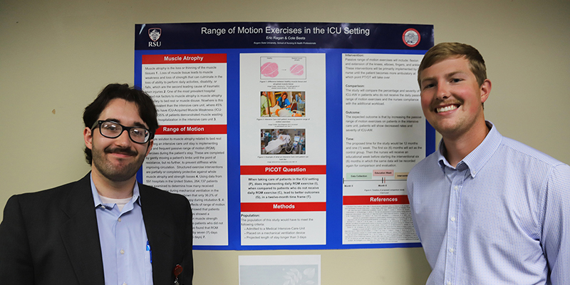Two smiling male students