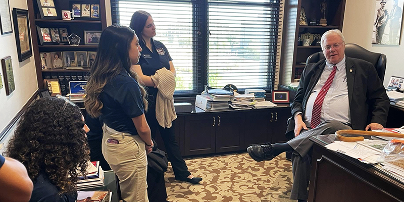 A group of people visit in an office