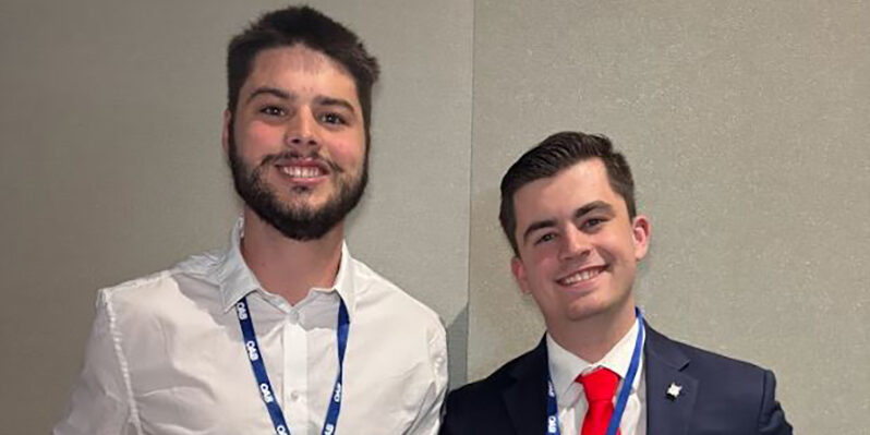Two male RSU students smile.