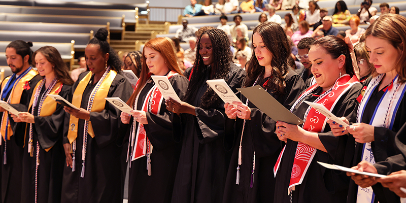 RSU Nursing graduates stand in a line during their pinning ceremony