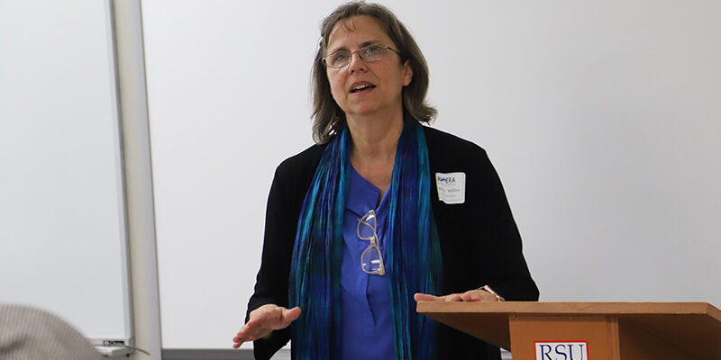 A woman speaking at a podium