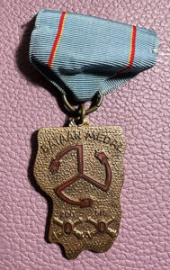 Bataan medal on teal ribbon with two red strips