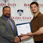 Hawken Grubbs, instructor of technology and justice studies, congratulated students on their outstanding showing in the National Cyber League Competition. A smiling male professor congratulates a student