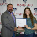 Hawken Grubbs, instructor of technology and justice studies, congratulated students on their outstanding showing in the National Cyber League Competition. A smiling male professor congratulates a student