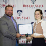 Hawken Grubbs, instructor of technology and justice studies, congratulated students on their outstanding showing in the National Cyber League Competition. A smiling male professor congratulates a student